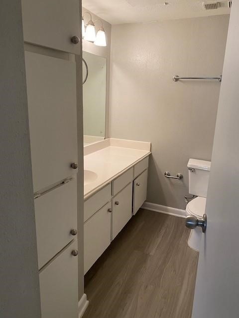 2250 Bering Drive, Unit 98 Houston, TX 77057 - Photo 11 of 14 a bathroom with a granite countertop sink mirror vanity and toilet