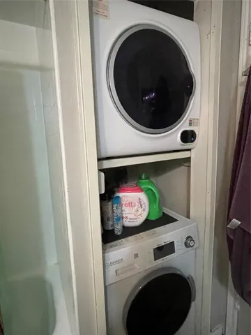 a view of a house with a yard and potted plants