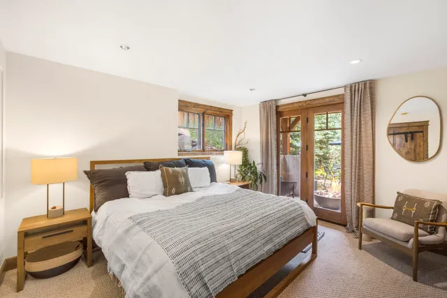 a bedroom with a large bed and a couch