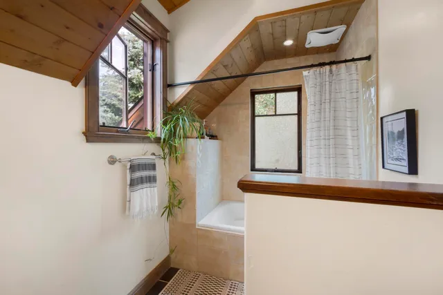 a bedroom with a bed and a dresser in it