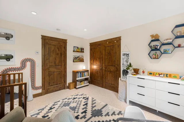 a bathroom with a double vanity sink mirror and bathtub