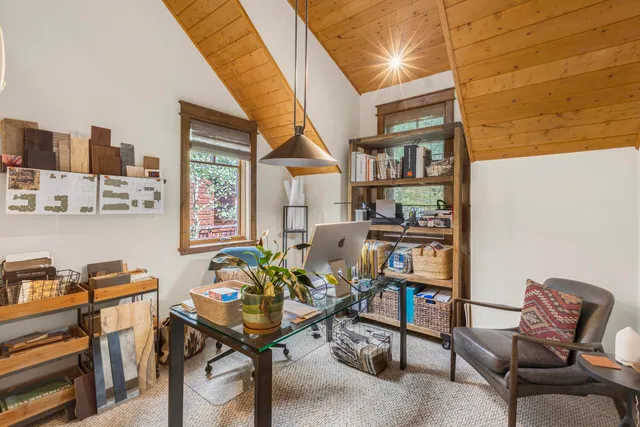 a workspace with furniture and window