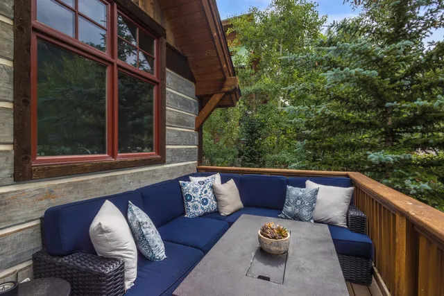 a room with furniture and a potted plant