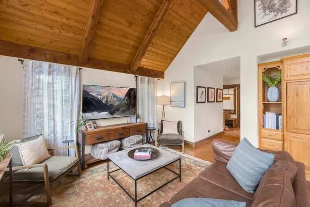 a view of a garden with a house in the background