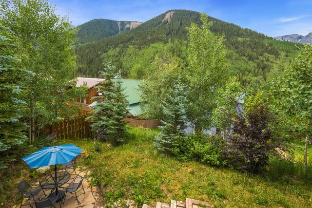 a view of a backyard of the house