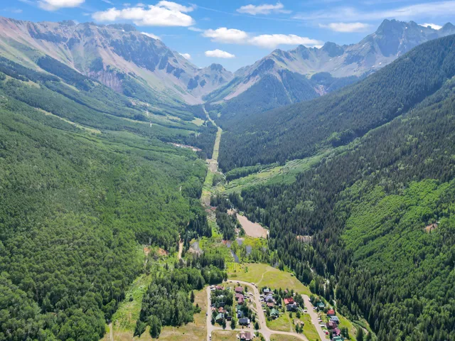 a view of a large building with a yard
