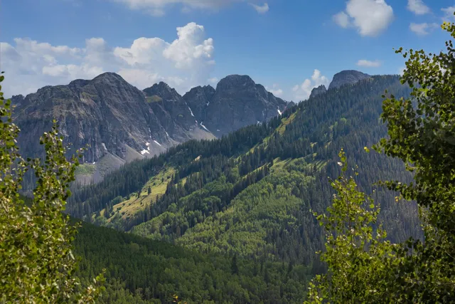 a view of a house with a mountain and a mountain view