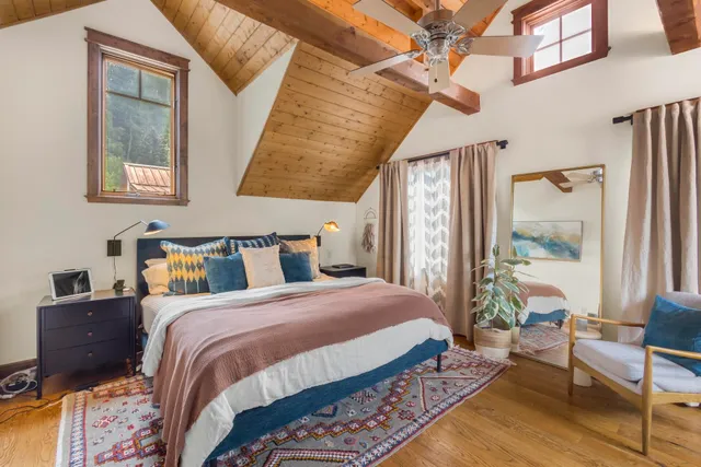 a bedroom with bed and a window