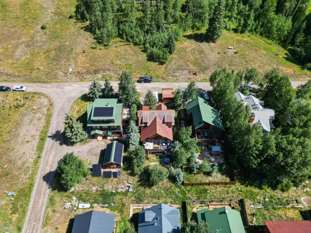 an aerial view of residential houses with outdoor space