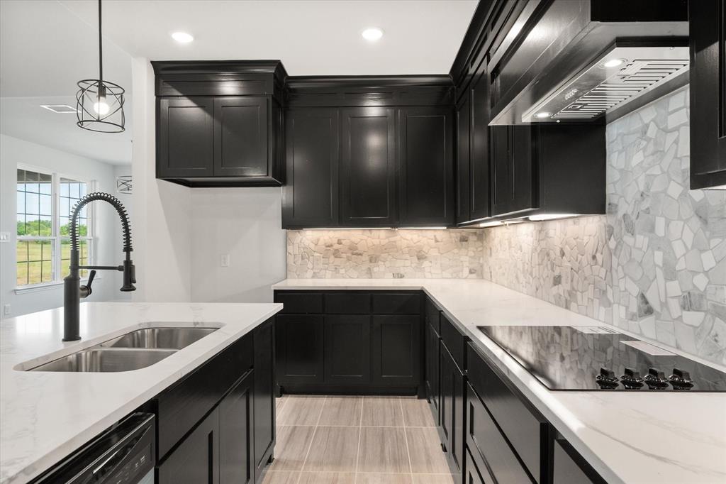 3400 Dobbins Road Corsicana, TX 75110 - Photo 10 of 40 a kitchen with a sink and a refrigerator