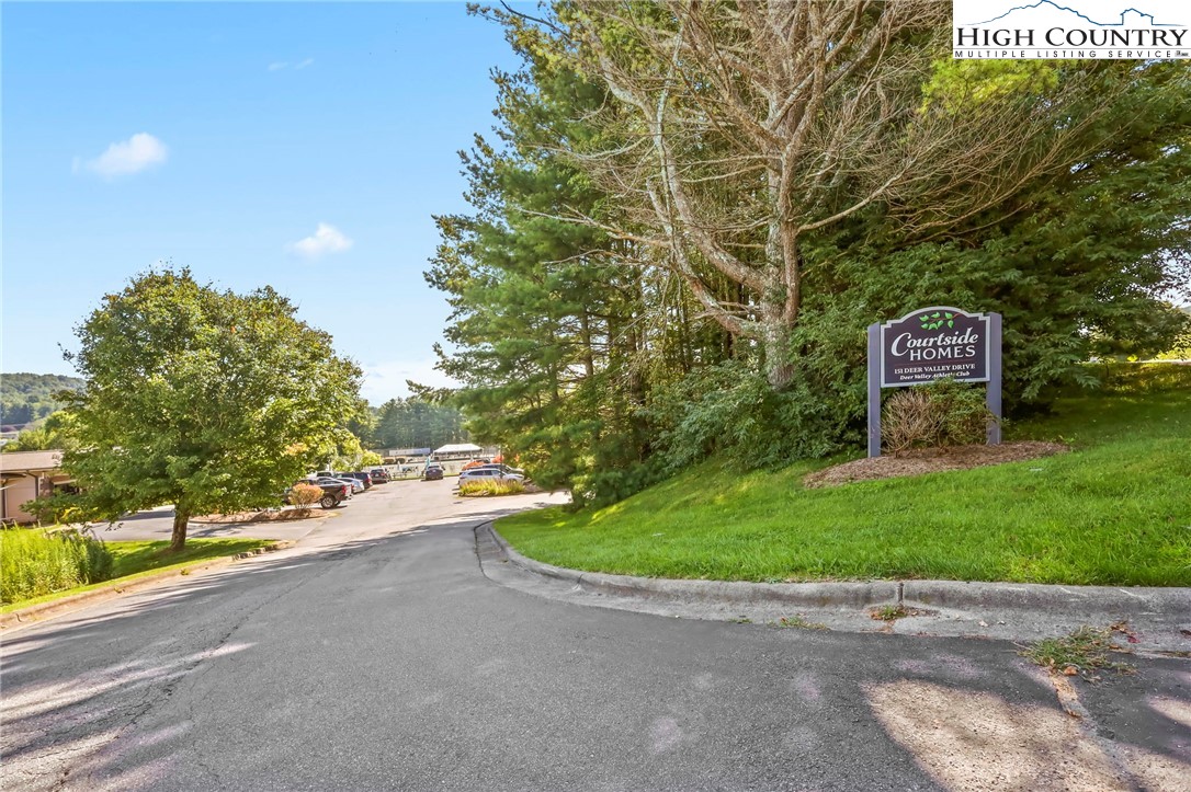 151 Deer Valley Drive, Unit 225 Boone, NC 28607 - Photo 1 of 31 a view of a street with a trees in the background