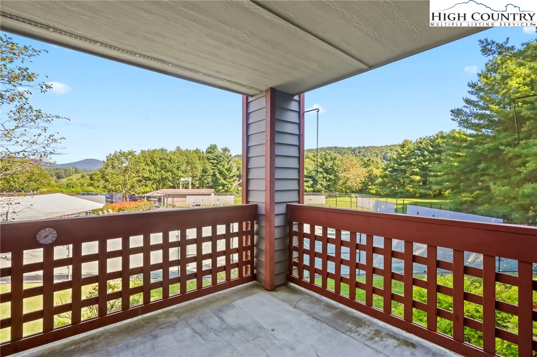 151 Deer Valley Drive, Unit 225 Boone, NC 28607 - Photo 11 of 31 a couple of table chair sitting in a balcony