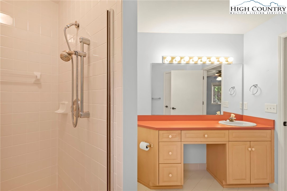 151 Deer Valley Drive, Unit 225 Boone, NC 28607 - Photo 17 of 31 a bathroom with a sink vanity and a mirror