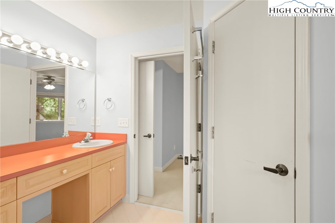 151 Deer Valley Drive, Unit 225 Boone, NC 28607 - Photo 18 of 31 a bathroom with a sink shower and a mirror