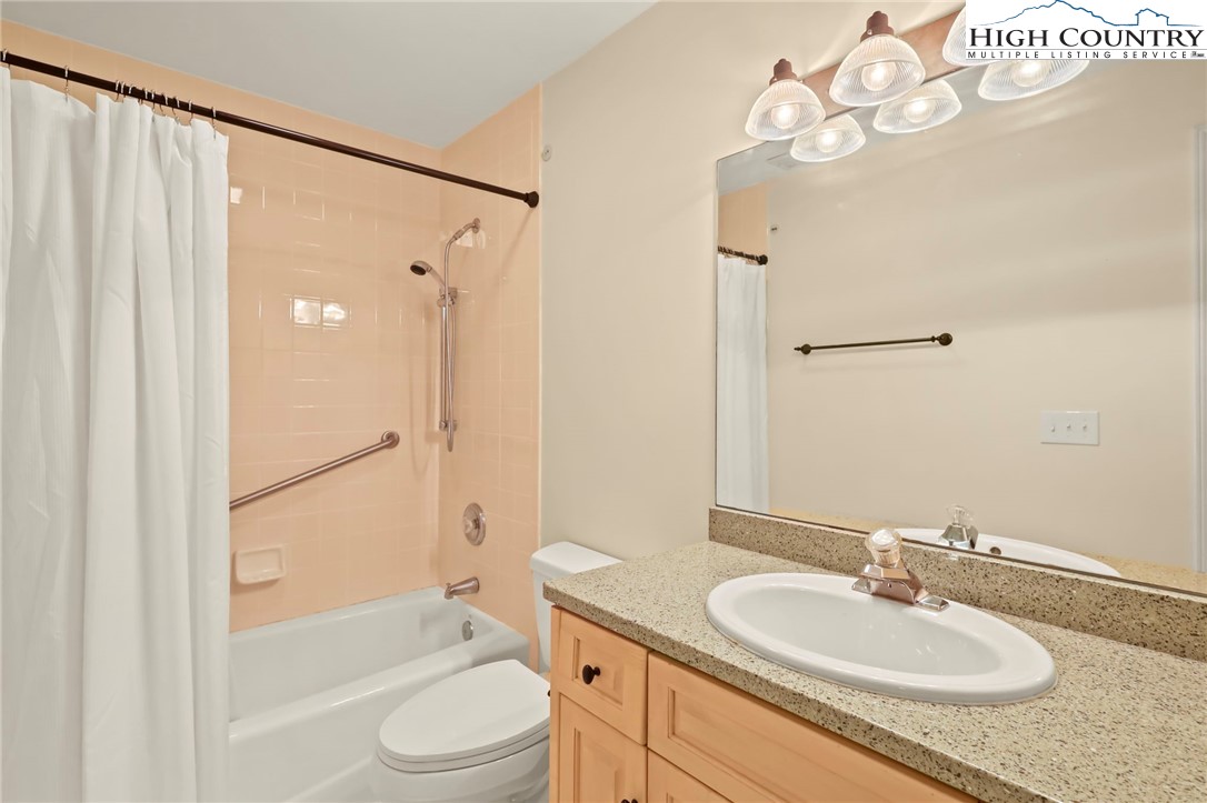 151 Deer Valley Drive, Unit 225 Boone, NC 28607 - Photo 24 of 31 a bathroom with a sink a toilet and shower