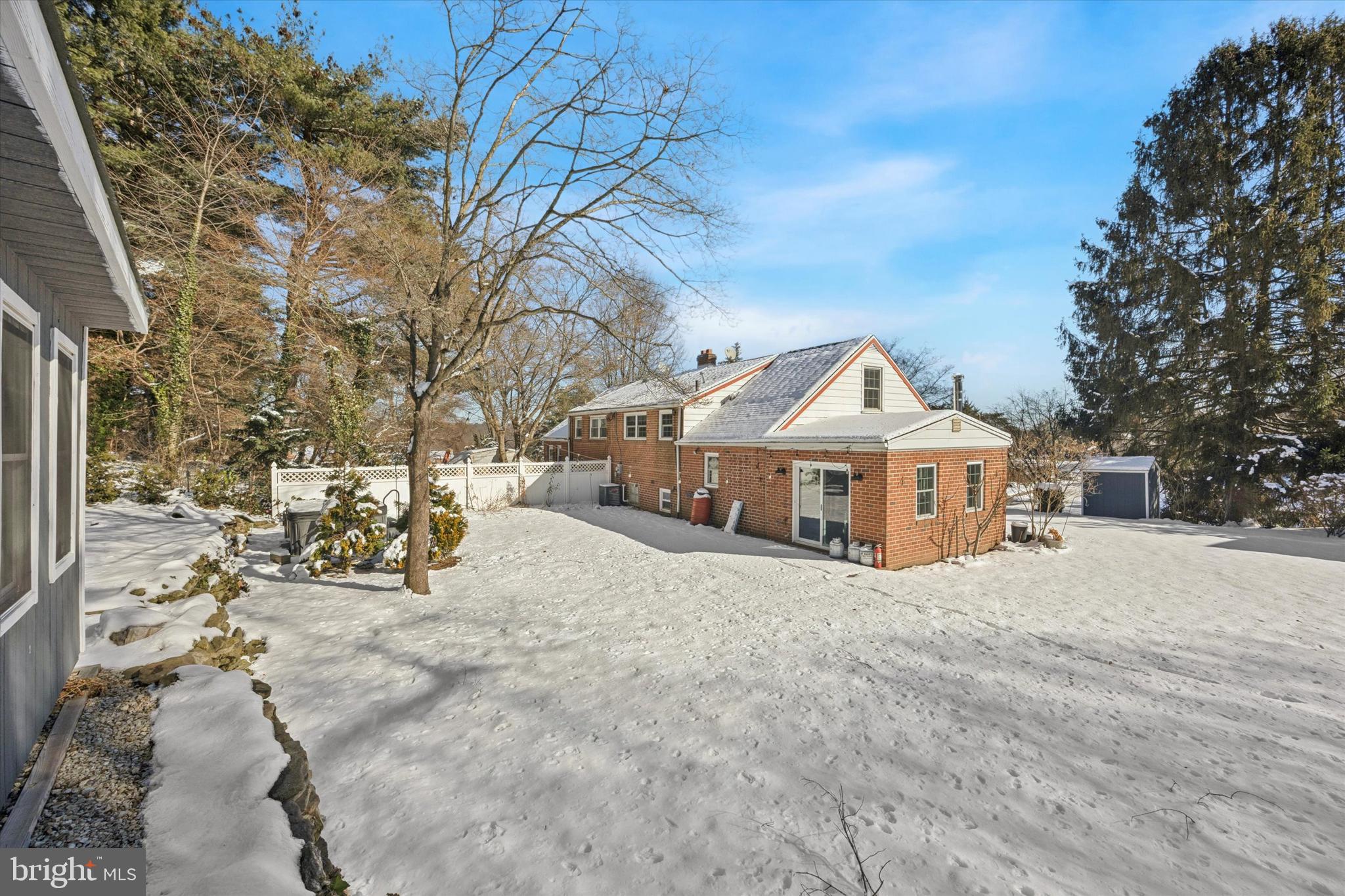 8516 Chippewa Road Philadelphia, PA 19128 - Photo 15 of 20 a view of a house with a yard covered in snow