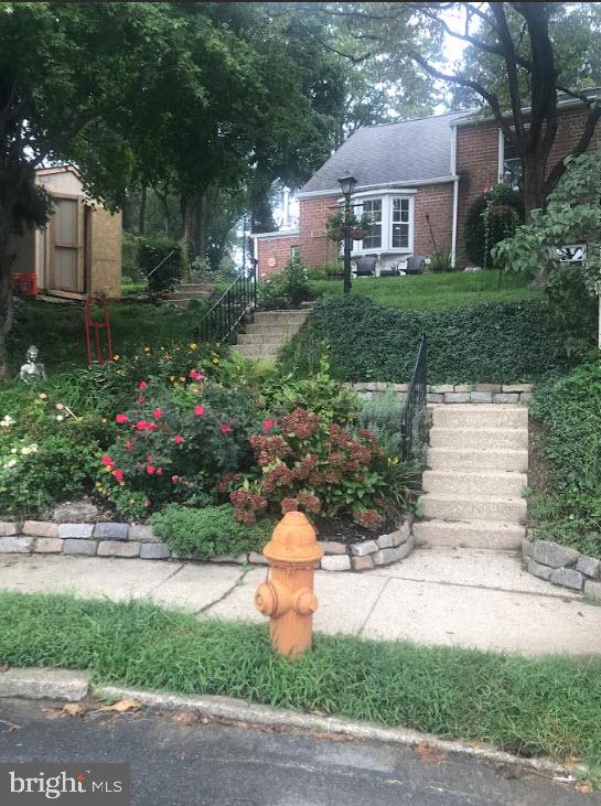 8516 Chippewa Road Philadelphia, PA 19128 - Photo 18 of 20 a front view of a house with a yard and a garage