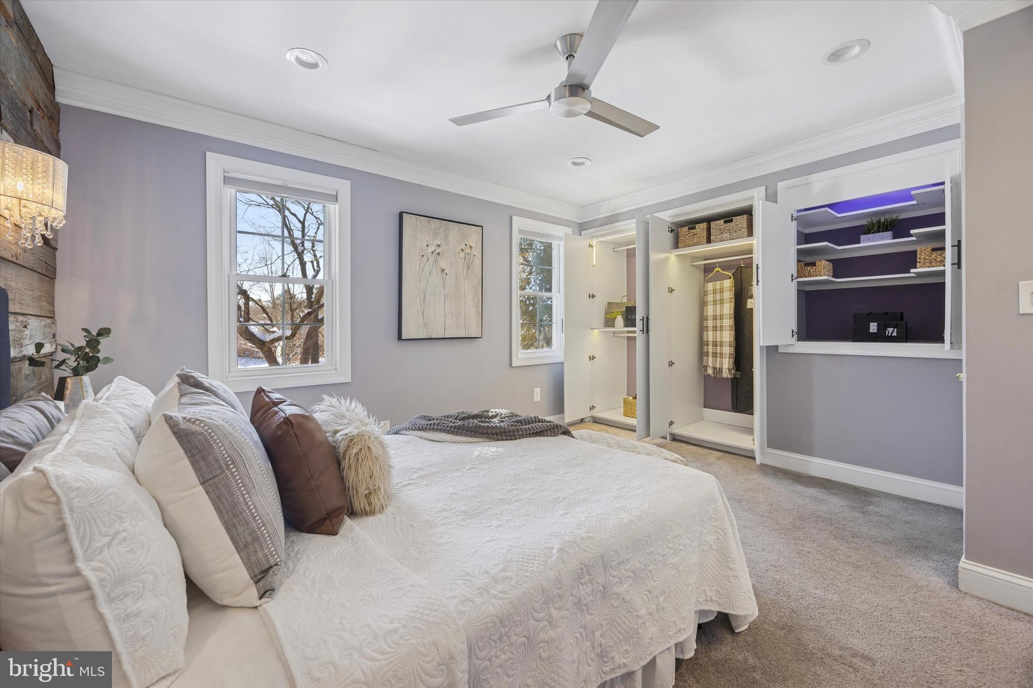 8516 Chippewa Road Philadelphia, PA 19128 - Photo 8 of 20 a bedroom with a bed and a chandelier