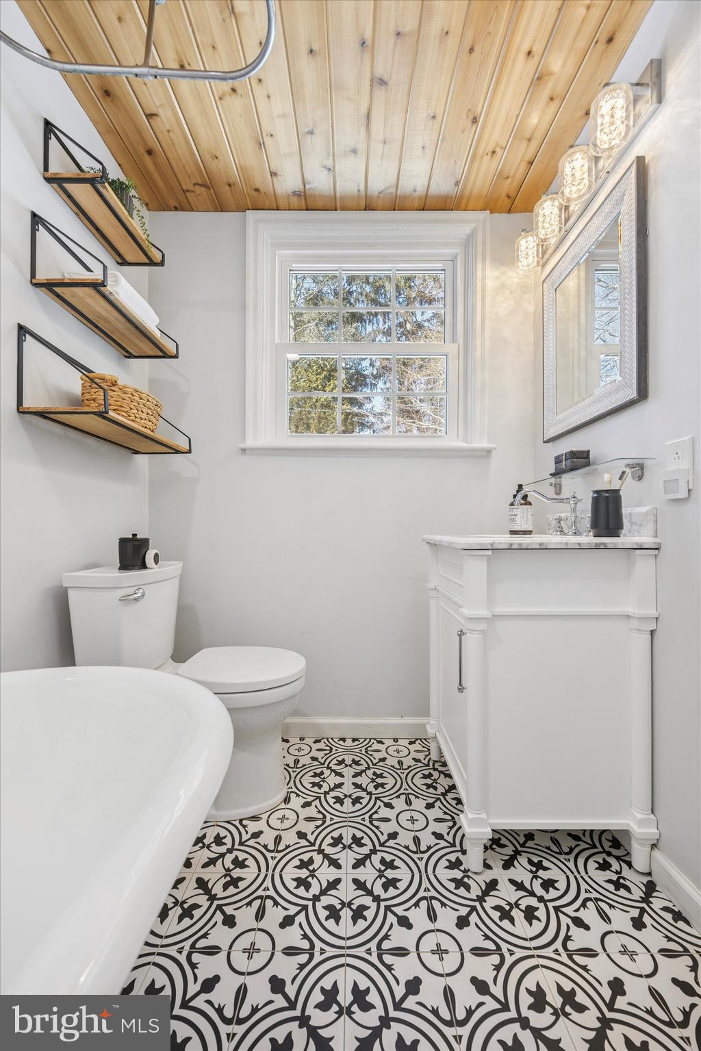 8516 Chippewa Road Philadelphia, PA 19128 - Photo 9 of 20 a bathroom with a sink toilet and mirror