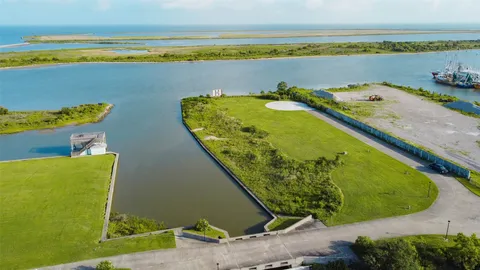 an aerial view of a house with a ocean view