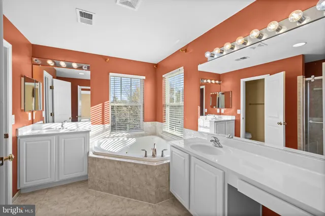 a bathroom with a bathtub and a window