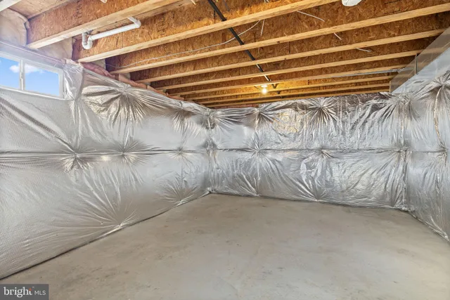 a view of a big house with a big yard and large trees