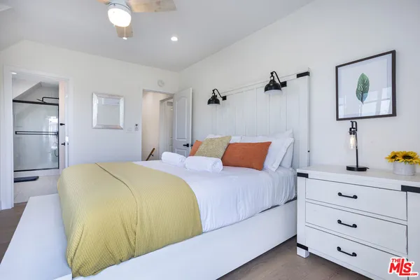 a bedroom with a bed and a cabinets
