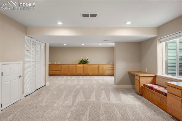 8271 Del Rio Road Peyton, CO 80831 - Photo 21 of 34 Basement rec room with storage and endless possibilities
