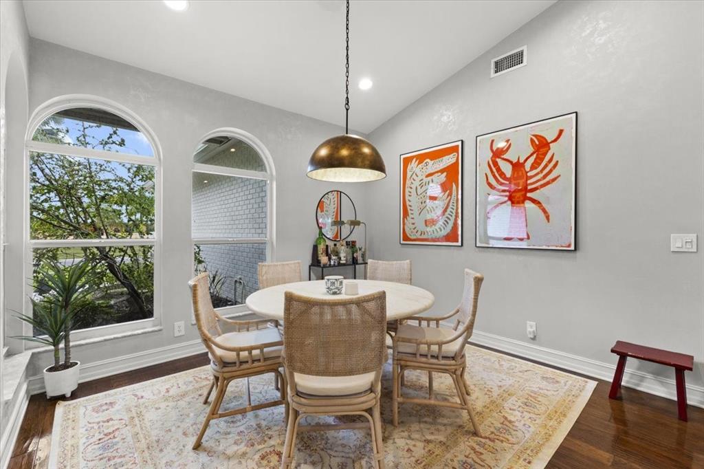 10349 Camelback Lane Boca Raton, FL 33498 - Photo 15 of 38 a dining room with wooden floor a chandelier a wooden table and chairs