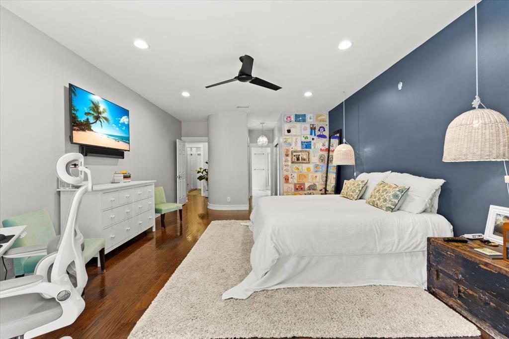 10349 Camelback Lane Boca Raton, FL 33498 - Photo 17 of 38 a spacious bedroom with a bed a couch and a flat screen tv