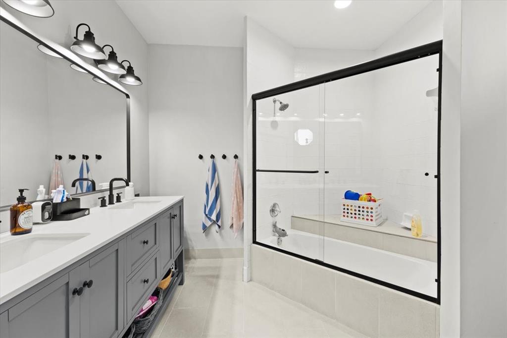 10349 Camelback Lane Boca Raton, FL 33498 - Photo 26 of 38 a bathroom with a double vanity sink mirror and shower