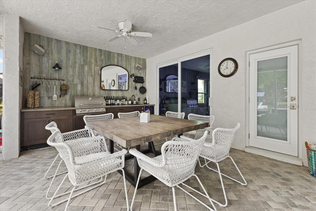 10349 Camelback Lane Boca Raton, FL 33498 - Photo 31 of 38 a view of a dining room with furniture and a large window