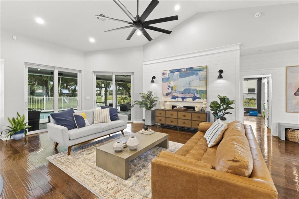 10349 Camelback Lane Boca Raton, FL 33498 - Photo 7 of 38 a living room with furniture fireplace and a large window