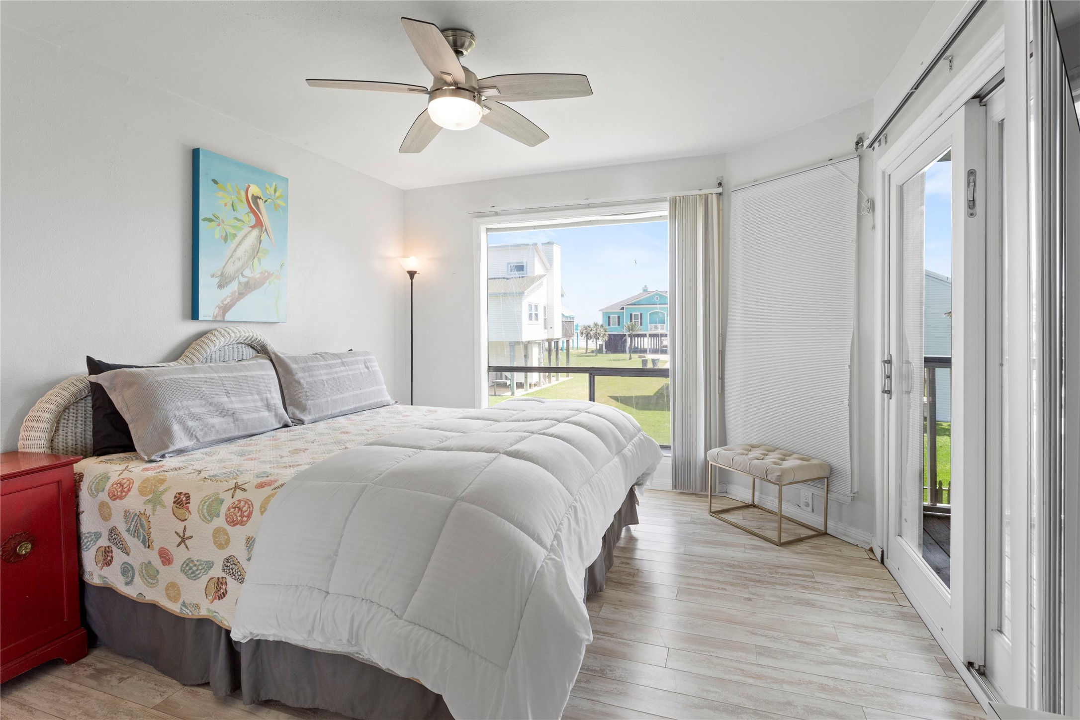 17627 Termini-San Luis Pass Road Galveston, TX 77554 - Photo 12 of 28 Luxurious primary bedroom featuring a spacious king-sized bed and abundant natural light.