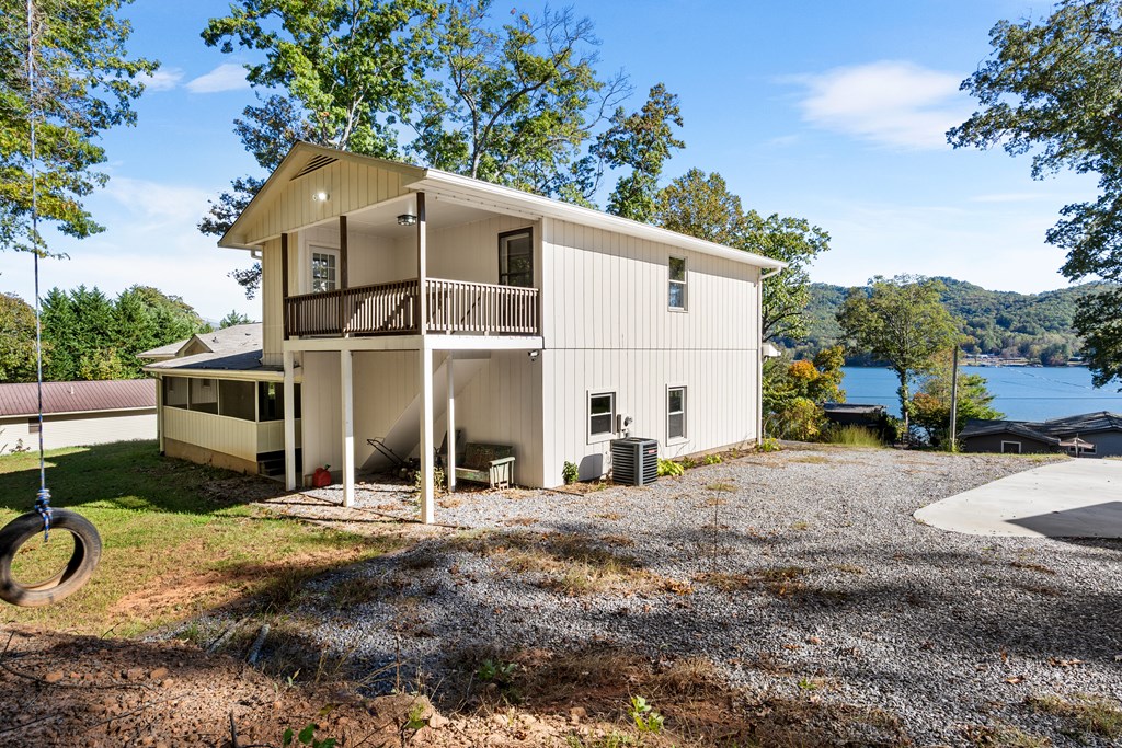 128 Cardinal Lane Hayesville, NC 28904 - Photo 12 of 40 a house with trees in the background