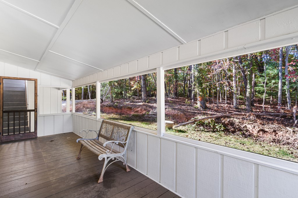 128 Cardinal Lane Hayesville, NC 28904 - Photo 16 of 40 a view of a room with wooden floor and furniture