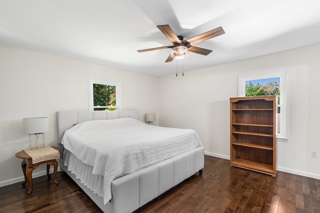 128 Cardinal Lane Hayesville, NC 28904 - Photo 26 of 40 a bedroom with a bed and a chandelier