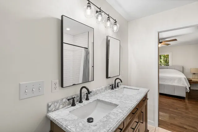 a bathroom with a sink and a mirror
