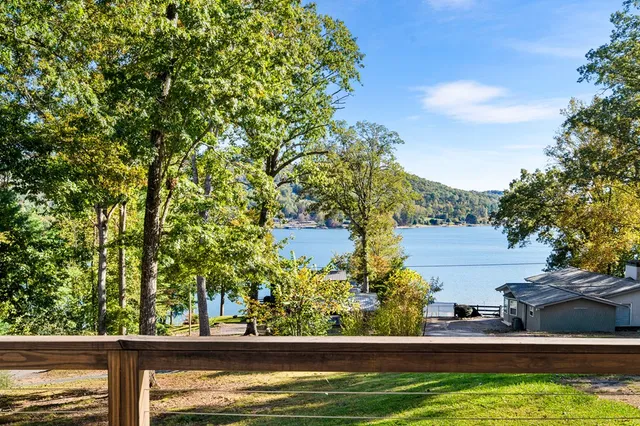 a view of swimming pool from a lake view