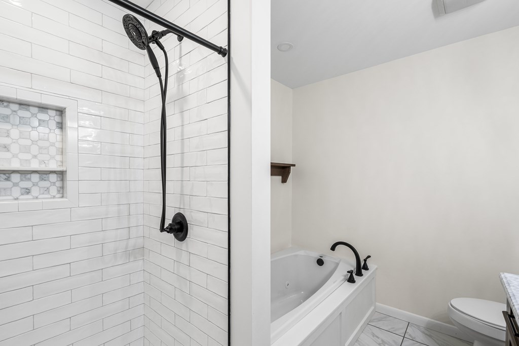 128 Cardinal Lane Hayesville, NC 28904 - Photo 36 of 40 a bathroom with a shower and a bathtub