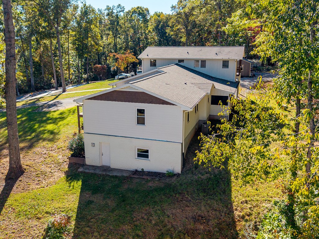 128 Cardinal Lane Hayesville, NC 28904 - Photo 38 of 40 a view of a house with a yard and sitting area