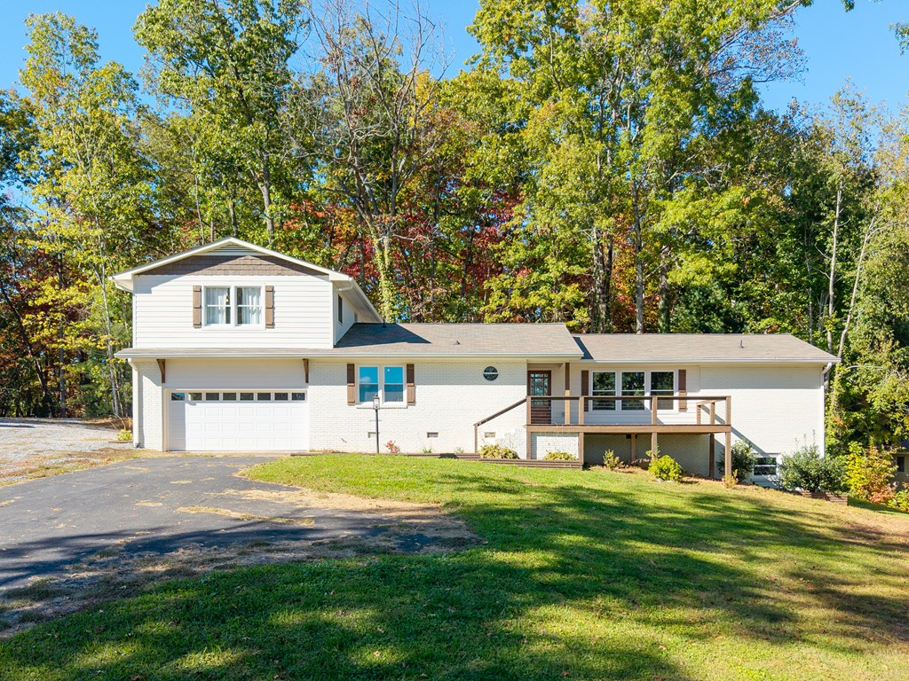 128 Cardinal Lane Hayesville, NC 28904 - Photo 4 of 40 a view of a house with a big yard and large trees