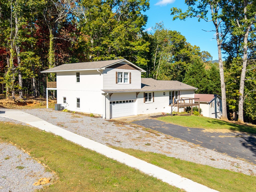 128 Cardinal Lane Hayesville, NC 28904 - Photo 9 of 40 a front view of a house with a yard and trees