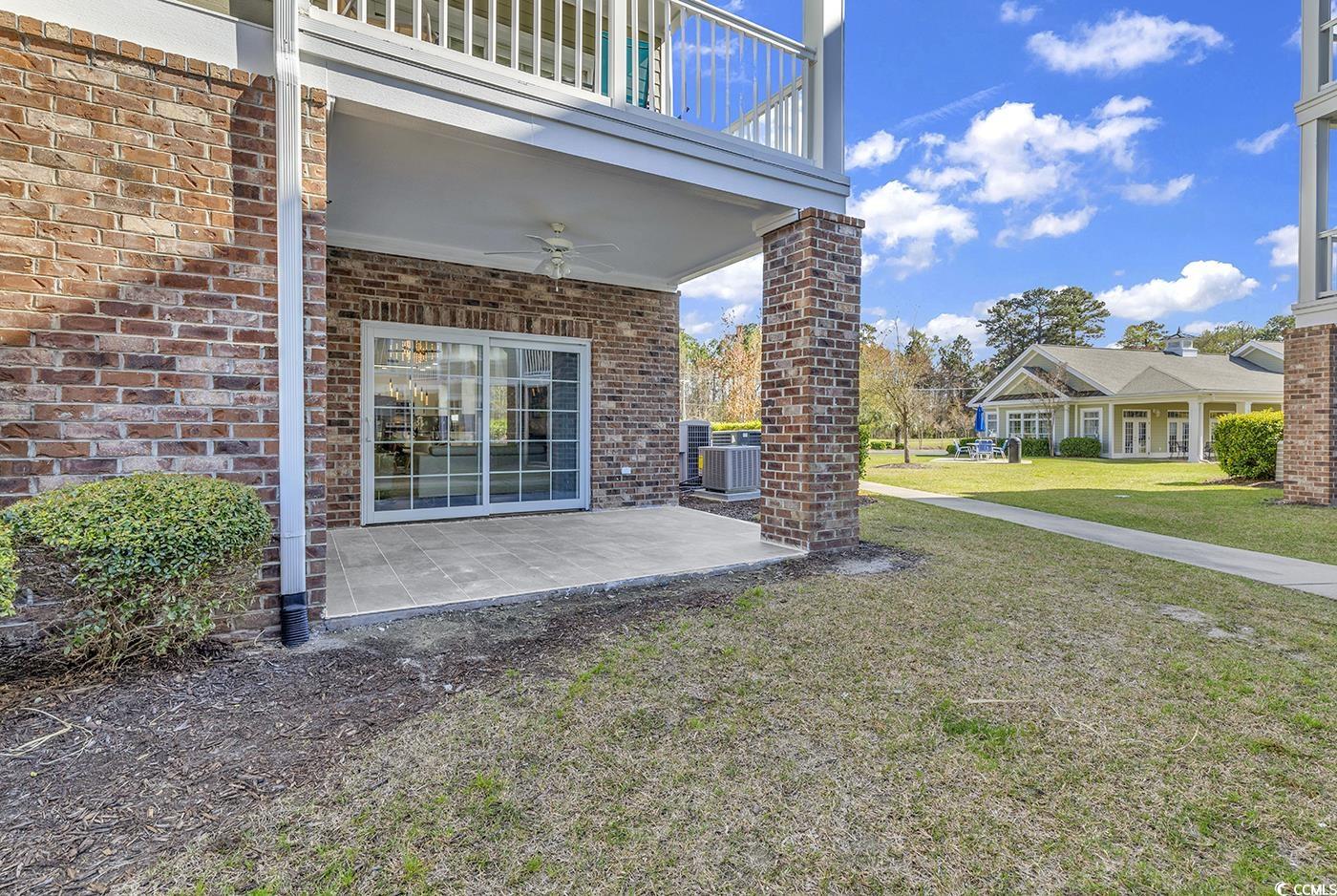 4821 Luster Leaf Circle, Unit 101 Myrtle Beach, SC 29577 - Photo 28 of 40 Exterior space featuring ceiling fan, a patio, cen