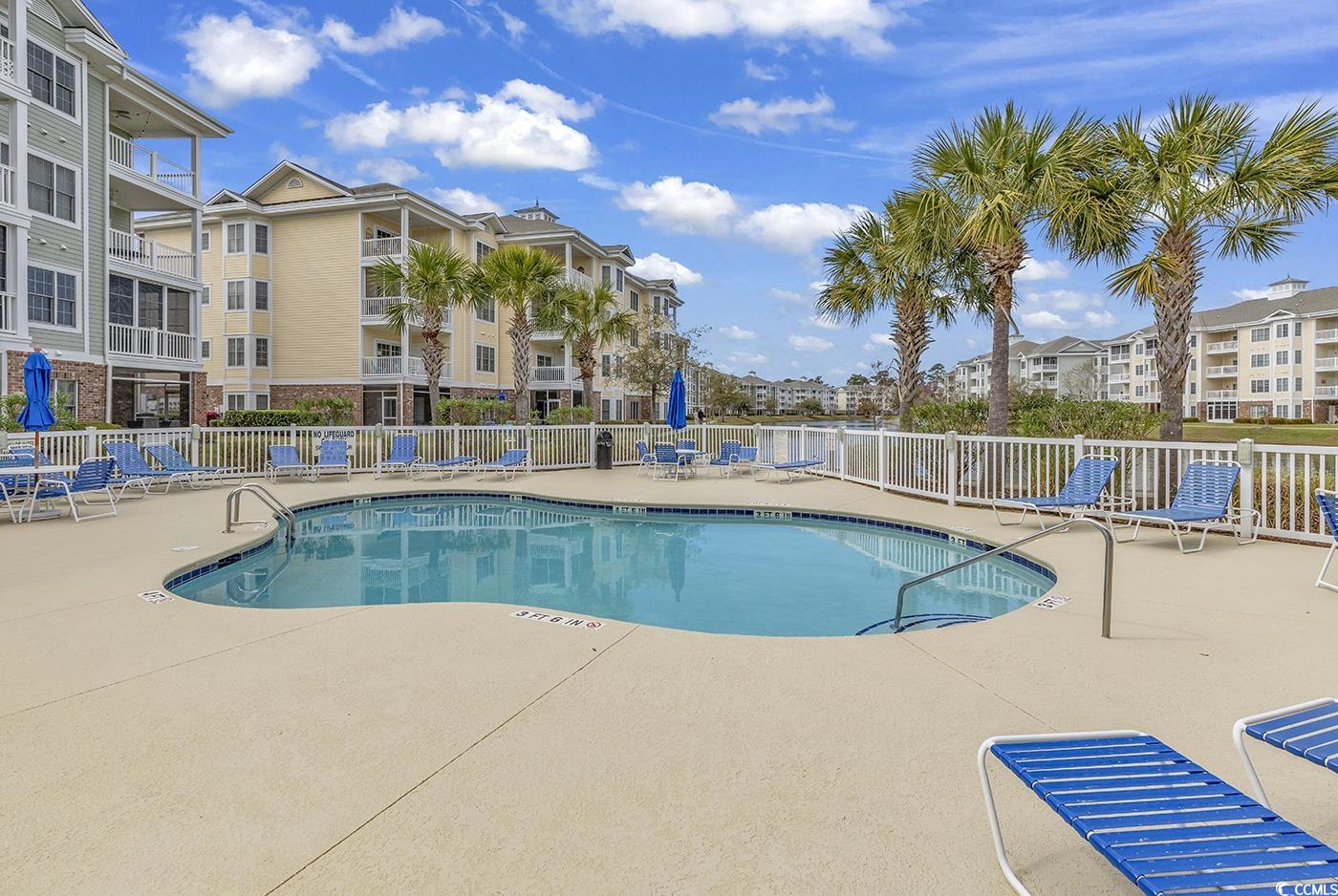 4821 Luster Leaf Circle, Unit 101 Myrtle Beach, SC 29577 - Photo 29 of 40 View of pool with a patio