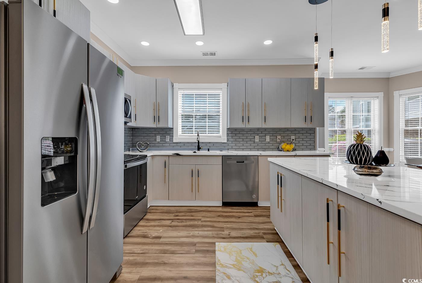 4821 Luster Leaf Circle, Unit 101 Myrtle Beach, SC 29577 - Photo 3 of 40 Kitchen featuring appliances with stainless steel