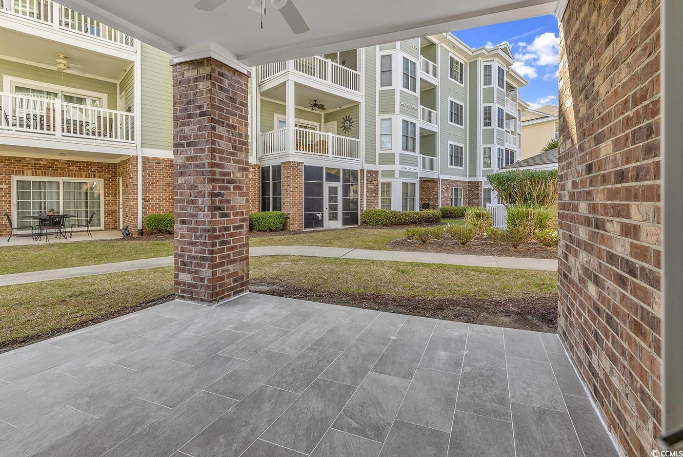 4821 Luster Leaf Circle, Unit 101 Myrtle Beach, SC 29577 - Photo 39 of 40 View of home's community featuring a yard
