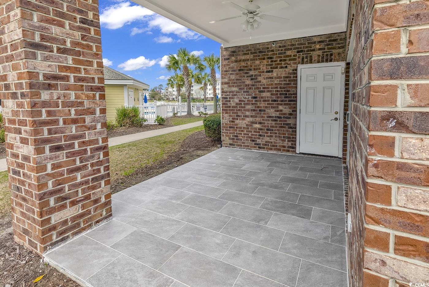 4821 Luster Leaf Circle, Unit 101 Myrtle Beach, SC 29577 - Photo 40 of 40 View of patio featuring ceiling fan