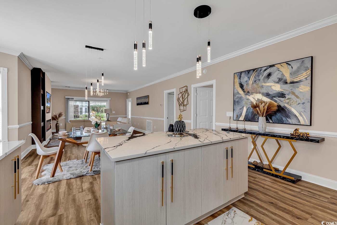 4821 Luster Leaf Circle, Unit 101 Myrtle Beach, SC 29577 - Photo 7 of 40 Kitchen with pendant lighting, light hardwood / wo