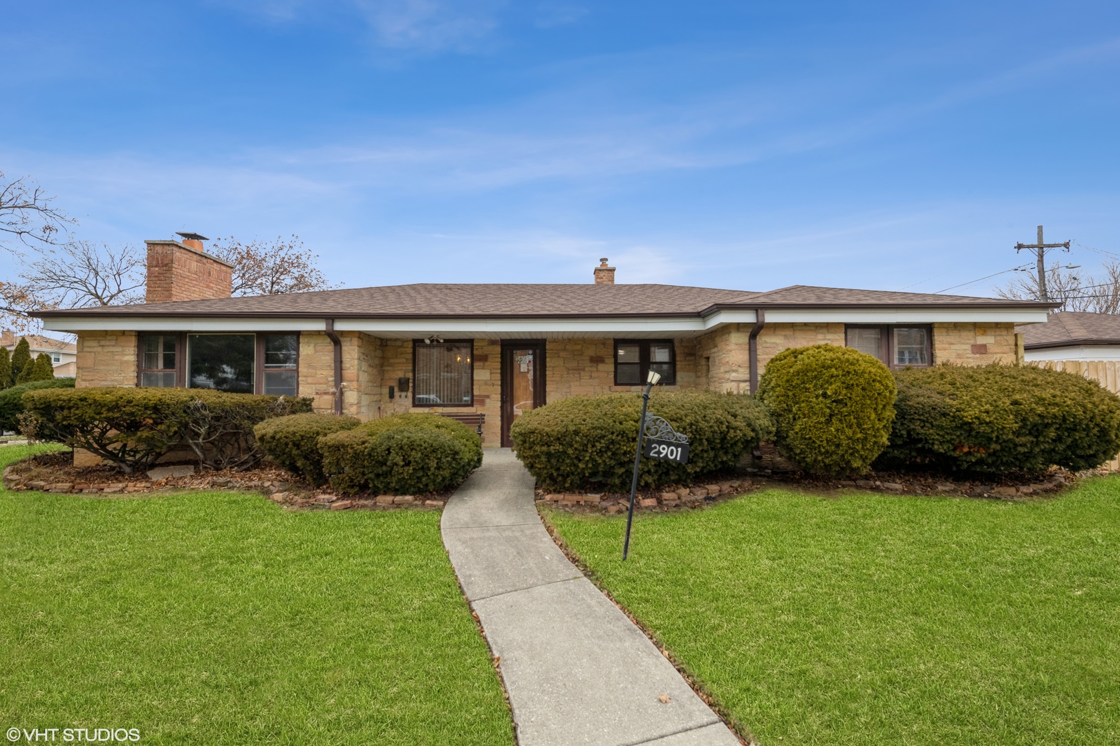 2901 Ernst Street Franklin Park, IL 60131 - Photo 1 of 8 a front view of a house with a yard and potted plants